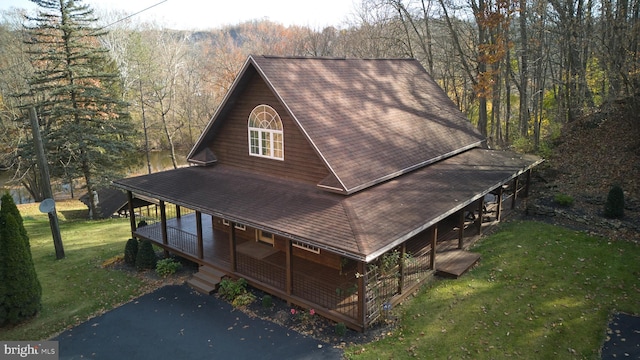 rear view of house with a yard