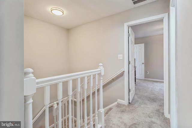 hallway with light carpet