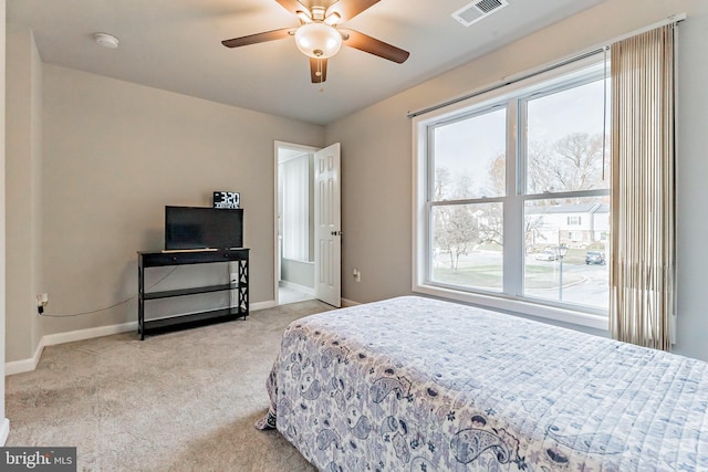 bedroom with light colored carpet and ceiling fan