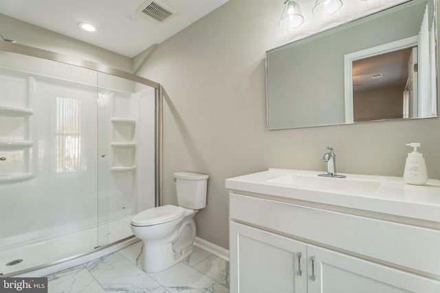 bathroom with vanity, toilet, and walk in shower