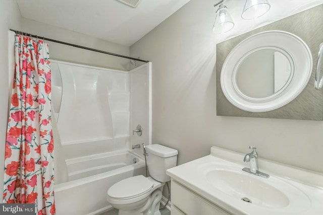 full bathroom featuring vanity, shower / bath combination with curtain, and toilet