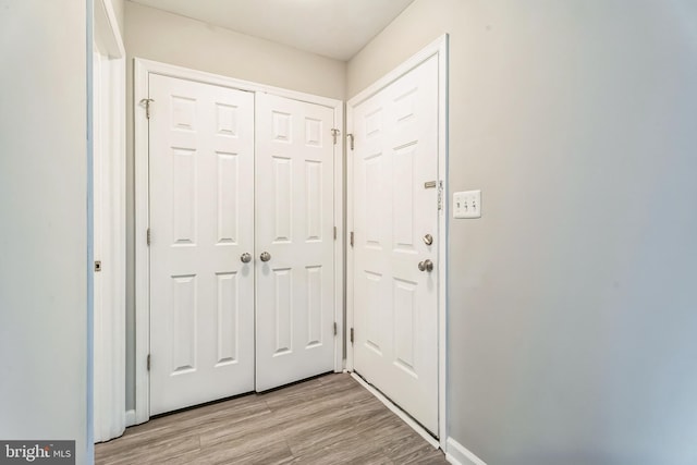 entryway with light hardwood / wood-style floors