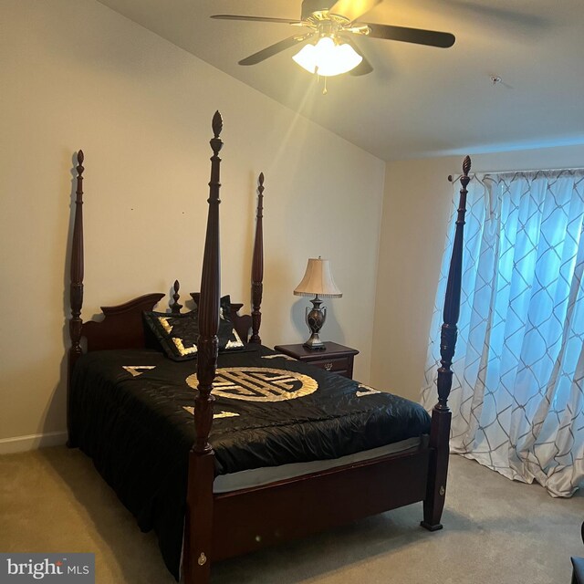 bedroom featuring ceiling fan and light colored carpet