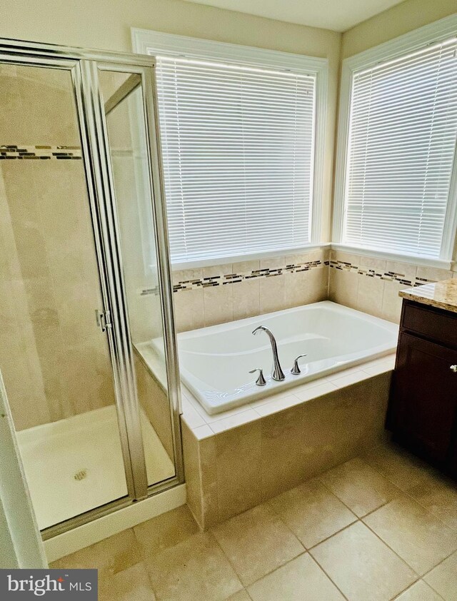 bathroom featuring vanity, tile patterned floors, and independent shower and bath