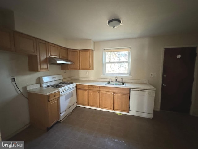 kitchen featuring white appliances and sink