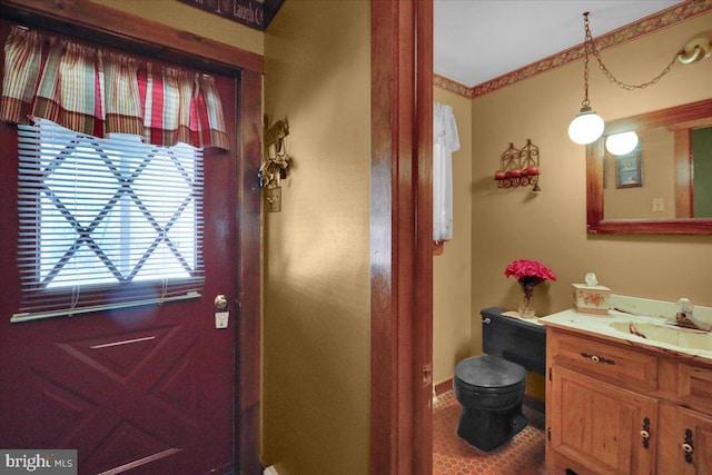 doorway featuring sink and tile patterned flooring