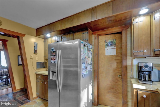 kitchen with stainless steel fridge with ice dispenser