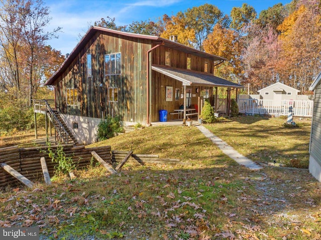 rear view of house with a lawn