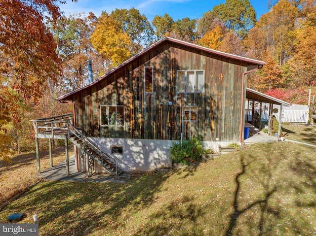 view of side of home featuring a yard