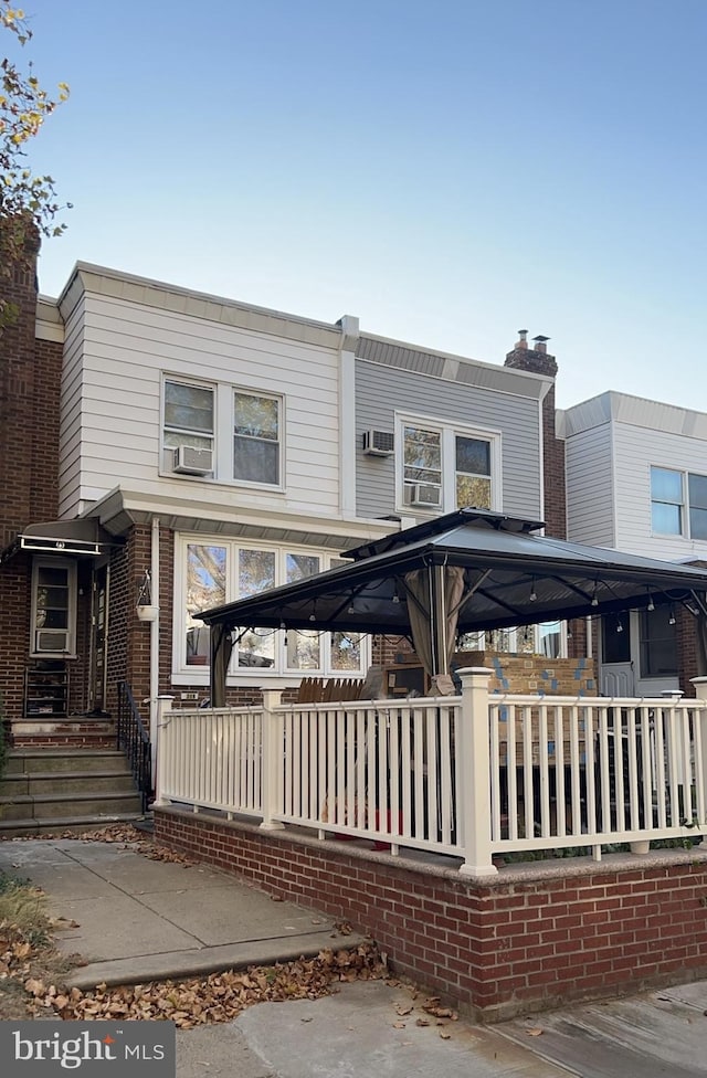 view of front of property with a gazebo