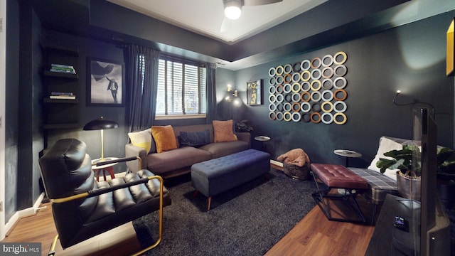 living room with hardwood / wood-style floors and ceiling fan