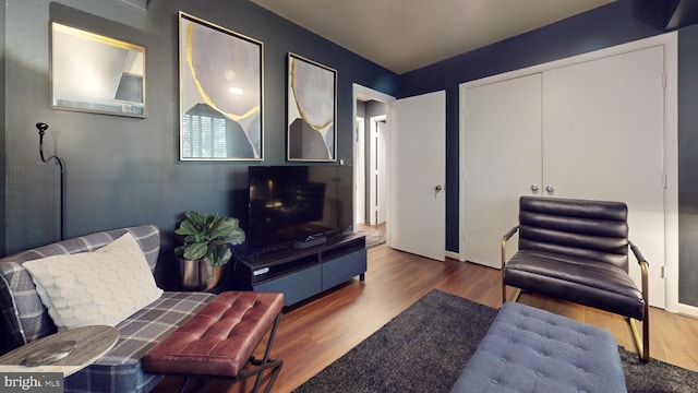 living room with dark wood-type flooring