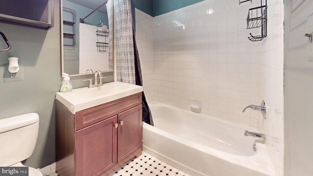 full bathroom featuring shower / bath combo, vanity, and toilet