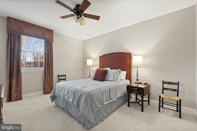 bedroom with light carpet and ceiling fan