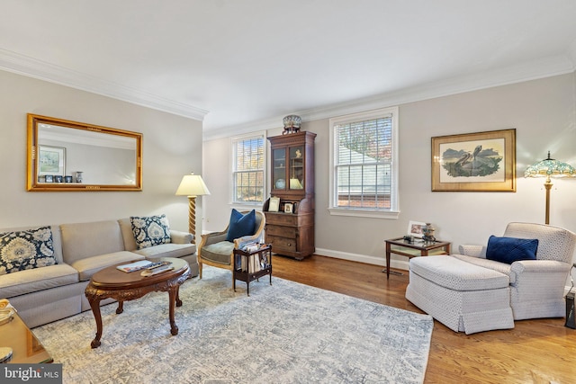 living room with light hardwood / wood-style floors and crown molding