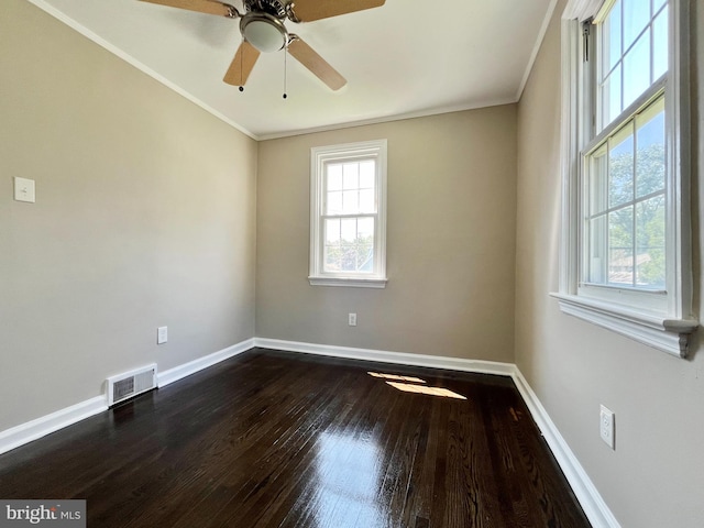 unfurnished room featuring ceiling fan, ornamental molding, and dark hardwood / wood-style flooring