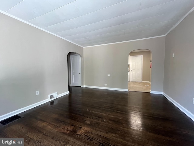 unfurnished room featuring ornamental molding and dark hardwood / wood-style floors