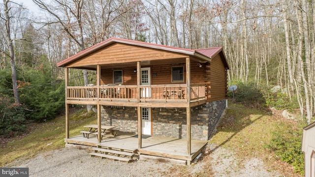 view of front of home with a wooden deck