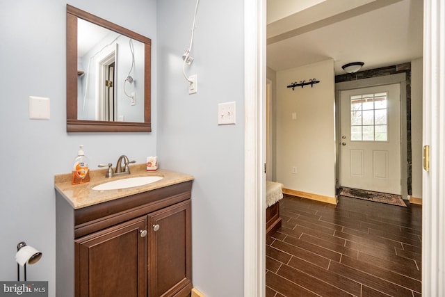 bathroom featuring vanity and hardwood / wood-style flooring