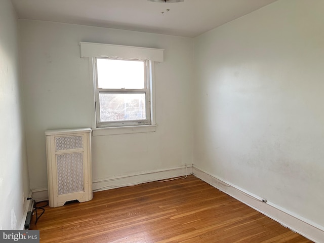 unfurnished room with light wood-type flooring