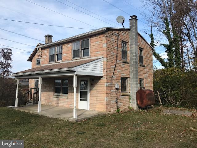 exterior space with a yard and a porch