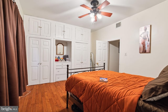 bedroom featuring light hardwood / wood-style floors and ceiling fan