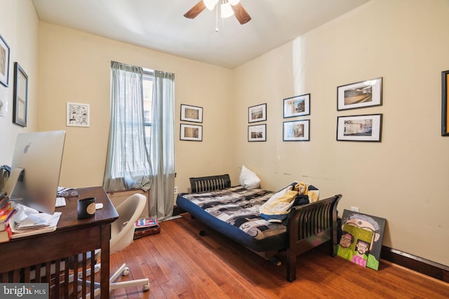 bedroom with wood-type flooring and ceiling fan