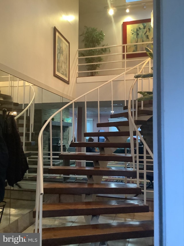 stairs featuring tile patterned floors