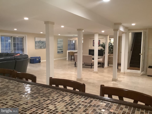 dining area featuring ornate columns