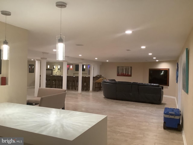 living room with decorative columns