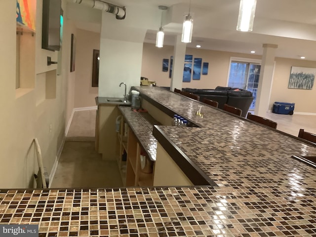 kitchen featuring hanging light fixtures and sink