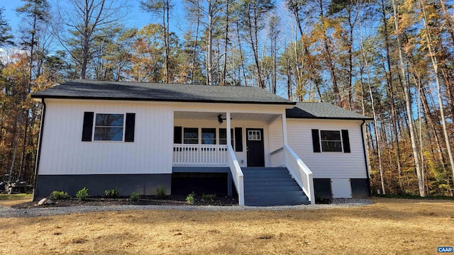 view of front of property with a front yard and a porch