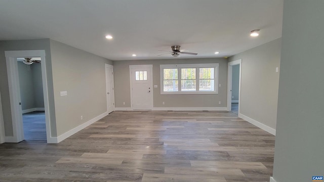 unfurnished room with light hardwood / wood-style flooring and ceiling fan