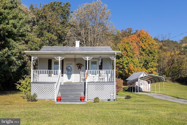 bungalow-style house with a carport, a front yard, and a porch