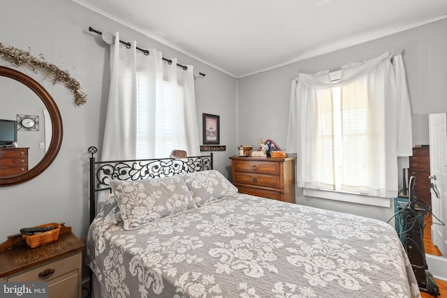 bedroom featuring crown molding