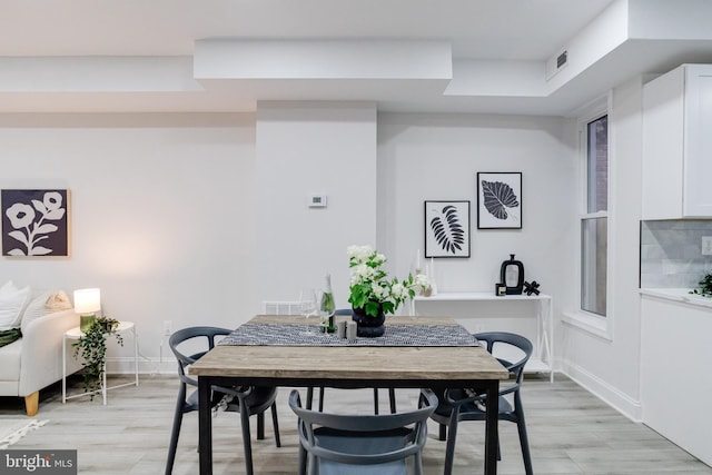 dining area with light hardwood / wood-style flooring