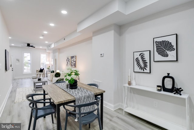 dining area featuring light hardwood / wood-style floors and ceiling fan