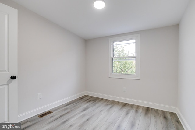 unfurnished room featuring light hardwood / wood-style floors