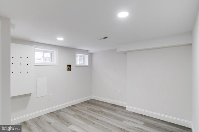 basement featuring light hardwood / wood-style floors