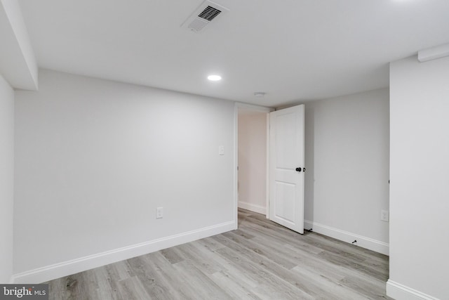 spare room with light wood-type flooring