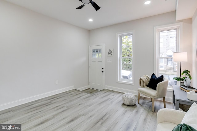 entrance foyer featuring light hardwood / wood-style floors and ceiling fan