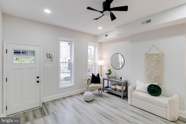 entryway with ceiling fan and light wood-type flooring