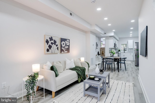 living room with light hardwood / wood-style floors