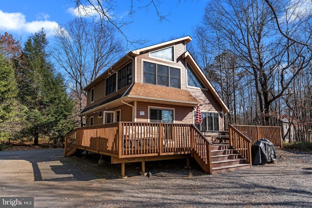 view of front facade with a wooden deck