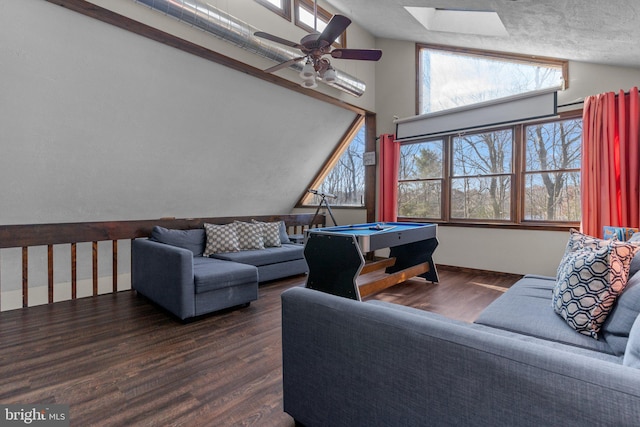 living room featuring vaulted ceiling with skylight, ceiling fan, billiards, and dark hardwood / wood-style flooring