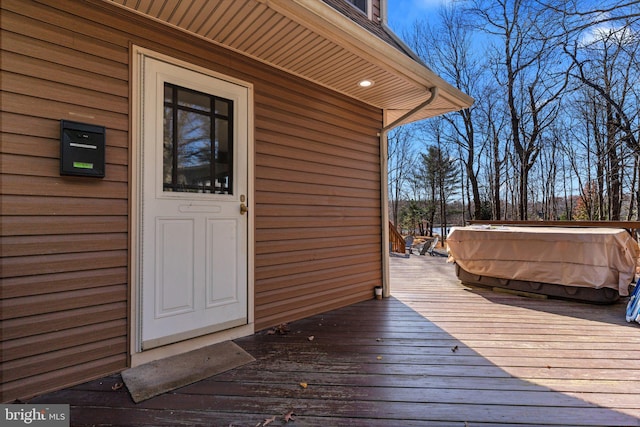 deck featuring a jacuzzi