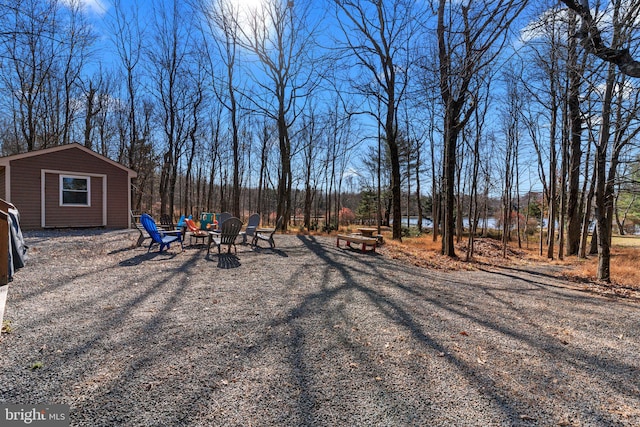 view of yard featuring a fire pit