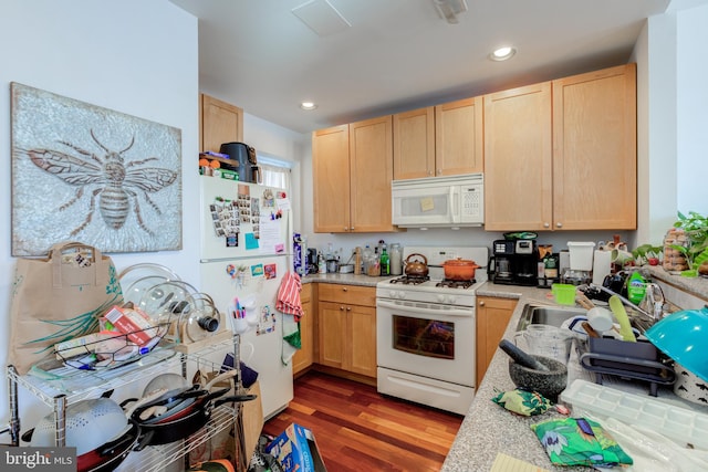 kitchen featuring light brown cabinets, sink, dark wood-type flooring, and white appliances