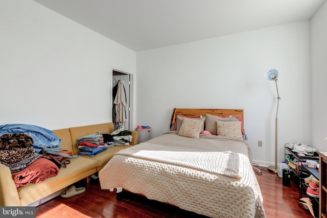 bedroom with hardwood / wood-style floors