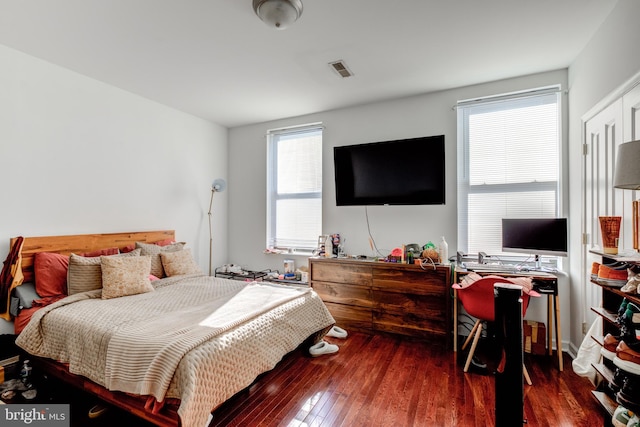 bedroom featuring dark wood-type flooring